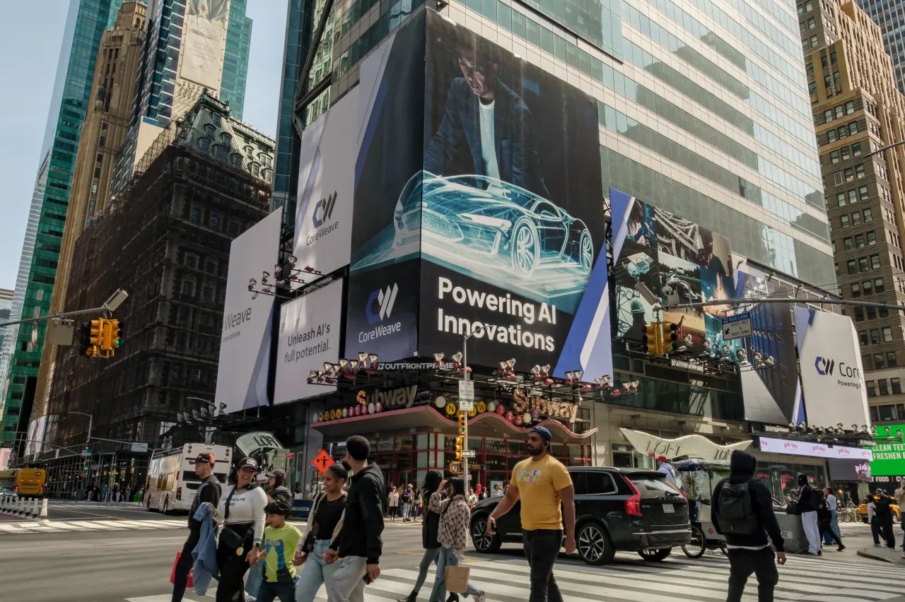 CoreWeave billboards reading Powering AI Innovations over a Times Square crosswalk